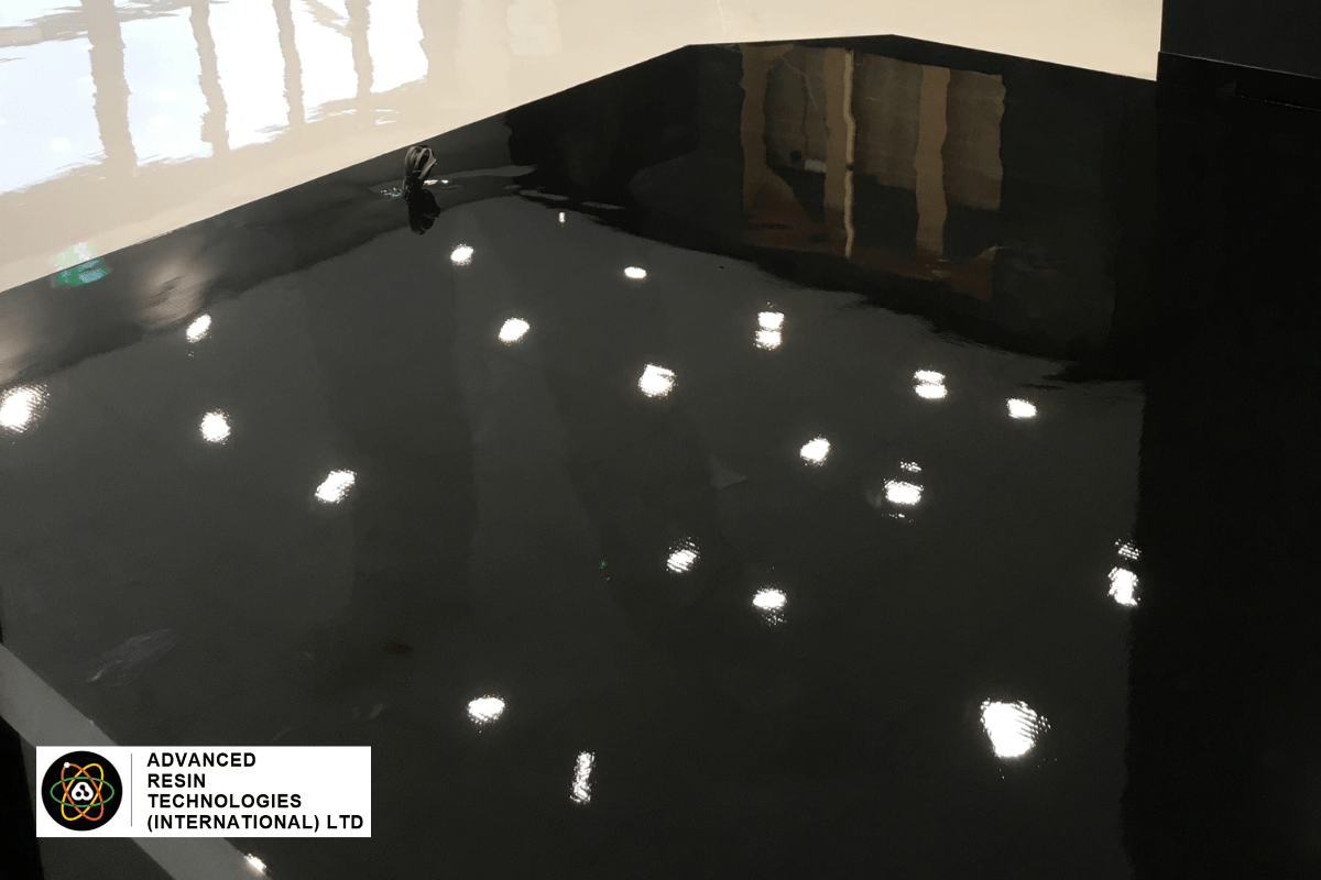A restaurant with newly installed epoxy resin flooring that has a distinctive and bespoke design.